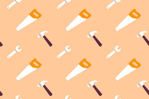 Construction hand tools pattern with saws, hammers and wrenches on biege background