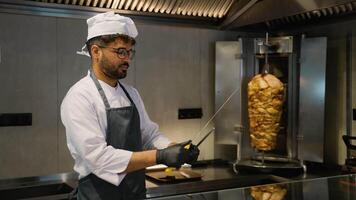 Side View of Middle Eastern Chef Sharpening Knife for Shawarma Doner Kebab video