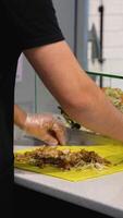 Assembling Shawarma Wraps with Meat and Sauce video