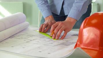 Focused architect meticulously drawing precise lines on a detailed design project video
