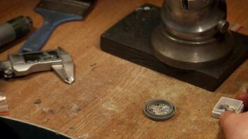 Jeweler meticulously measures gems with precision tools video