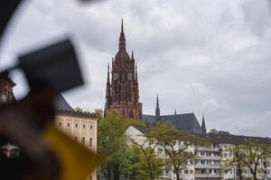 Frankfurt Cathedral and Urban Surroundings Under Cloudy Sky photo