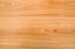 Light brown wooden surface with smooth texture and subtle grain lines photo