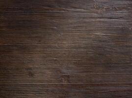 Rough dark wood texture with horizontal grain and aged rustic surface pattern photo