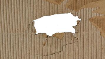 Small hole, Brown paper box texture or cardboard with torn for design background photo