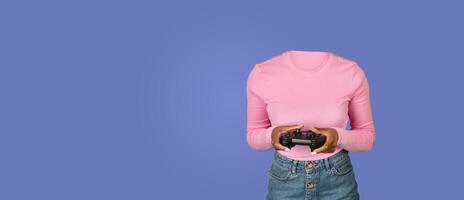 A person enjoying a gaming session stands against a plain blue background, holding a gaming controller. The headless image evokes a modern, minimalist approach to lifestyle representation. photo