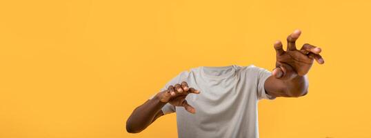 A creative representation shows man without head reaching out with hands. The collage emphasizes lifestyle and isolation, set against a bright backdrop. photo