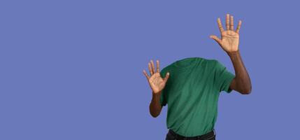 Headless person holding hands in front of him, purple background, panorama with copy space photo