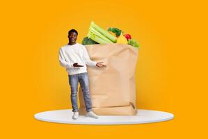 A customer stands with an open paper bag filled with fresh groceries, showcasing a variety of vegetables. The bright background emphasizes the modern shopping experience during changing times. photo