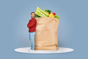 Customers adapt to the new normal by purchasing groceries online and using delivery services. A man carries a paper bag filled with fresh produce like vegetables and fruits. photo