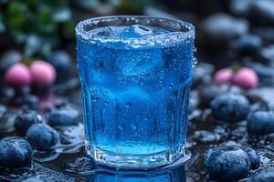 Refreshing Blueberry Cocktail with Ice and Berries in Nature-Themed Setting photo