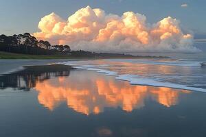 Serene Coastal Sunset with Reflected Clouds on Tranquil Beach Shore photo
