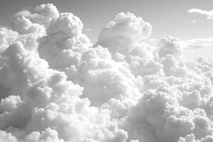 Dramatic Cloudscape with Fluffy White Clouds in a Clear Sky, Ideal for Nature and Weather-Themed Prints photo