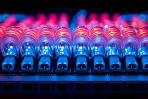 Close-Up of Fiber Optic Cables with Glowing LED Lights in a Data Center Setting photo