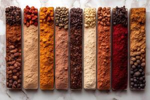 Assorted Aromatic Spices in Clean Lines on Marble for Culinary Design photo