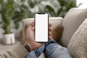 Hand Holding Smartphone Outdoors in Daylight, blank mobile screen mockup photo