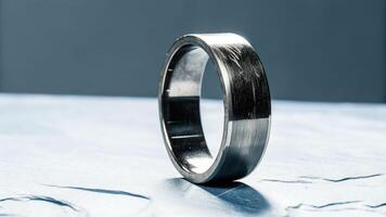 Macro shot of a titanium ring showing wear textured stone surface close-up detailed industrial concept photo