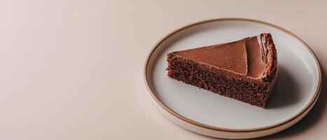 Decadent chocolate cake slice minimalist setting food photography neutral background close-up dessert delight photo