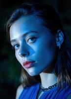 Moody portrait of a young woman nighttime setting close-up photography dramatic lighting artistic expression photo