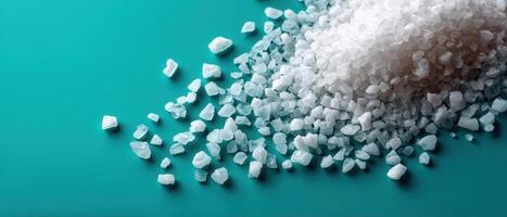 Pouring sea salt on turquoise surface food photography kitchen setting close-up culinary art photo