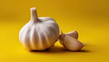 Harvesting fresh garlic culinary uses kitchen preparation vibrant yellow backdrop photo