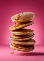 Stacked pancakes with maple syrup vibrant background food photography delicious dessert close-up culinary art photo