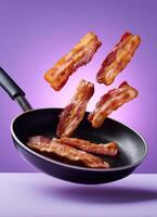 Bacon strips flying from frying pan kitchen food photography artistic close-up culinary delight photo