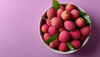 Vibrant lychee bowl overflowing with fresh fruits top view colorful background culinary delight photo
