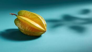 Starfruit still life on turquoise surface nature photography serene environment photo
