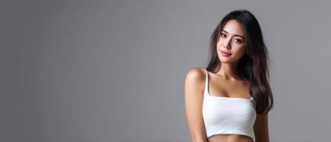 Asian woman posing elegantly in studio beauty photography soft lighting fashion concept photo