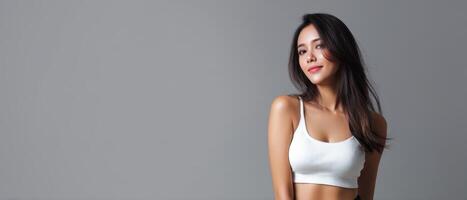 Asian woman posing elegantly in a minimalistic studio fashion photography modern aesthetic photo