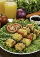 Grilled pineapple and vegetable skewers on lettuce bed, a vibrant and nutritious display photo