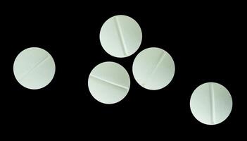 white antibiotic pills isolated photo
