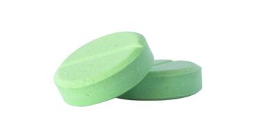 two green pills for pharmacy photo