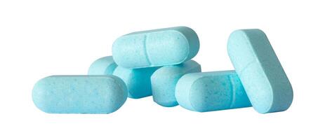 pile of medical blue drug capsules photo
