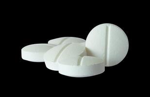 white pills on white photo