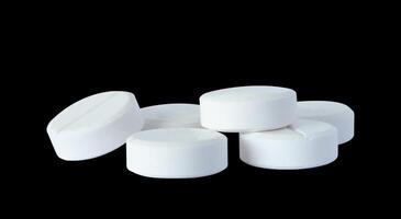 white pills isolated on white photo