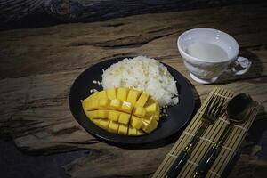 Street food, sticky rice with mango, Thai food, good taste, Asian food photo
