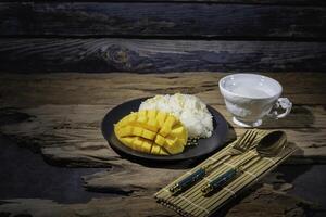 Street food, sticky rice with mango, Thai food, good taste, Asian food, very popular. photo