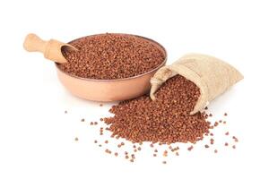 Raw buckwheat isolated on white photo