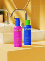 Colorful shampoo and conditioner bottles mockup on bathroom sink counter with warm tile background and metal faucet psd