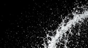 Water splashing on a black background photo