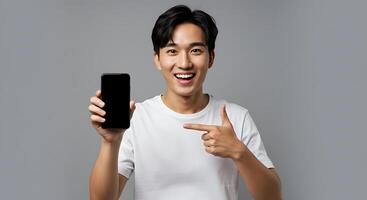 A man holding up a smart phone and pointing at it photo