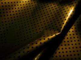 Gold texture with dots and reflection at night for luxury vintage background. photo
