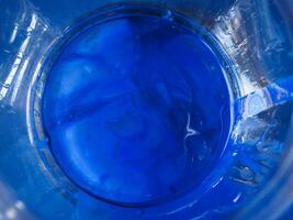 Blue watercolor in broken glass for texture abstract art photo