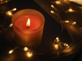 Candles in the dark at night about Moody magic. photo