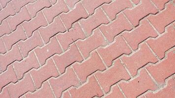 red paving stones with a visible texture. background or textura photo