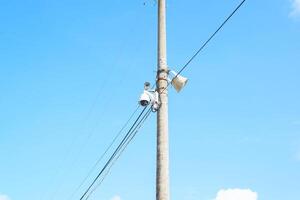 Group of surveillance cameras on pole in the city. Surveillance of citizens, face recognition system. photo