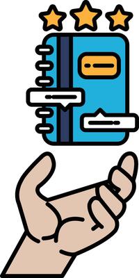 A hand holding a blue book with stars on it