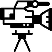 A filled style icon of a camera vector